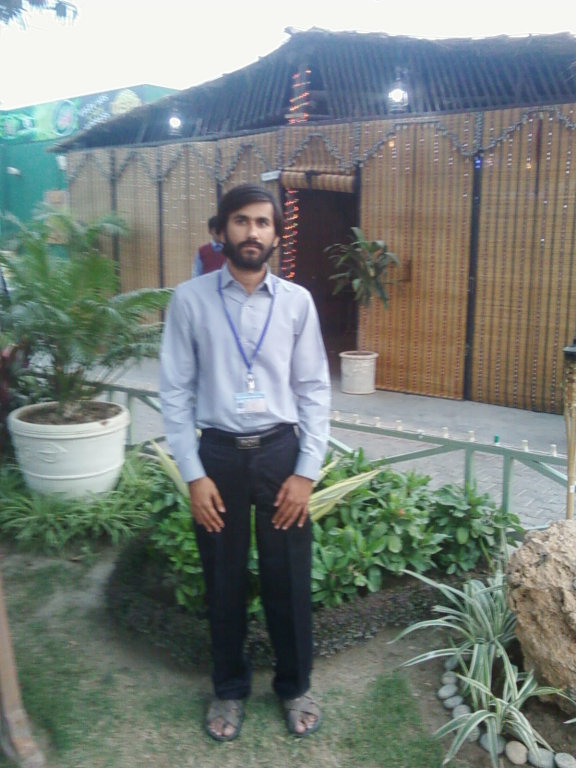 Aatif standing In lawn.