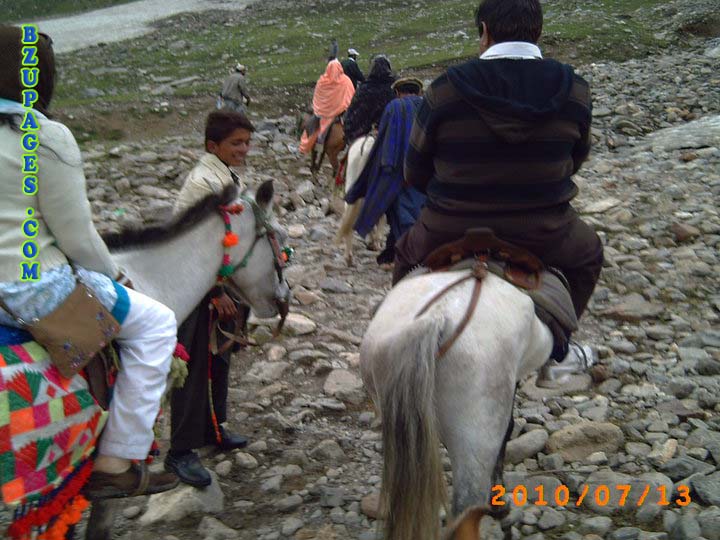 Girl and Boy riding on horse