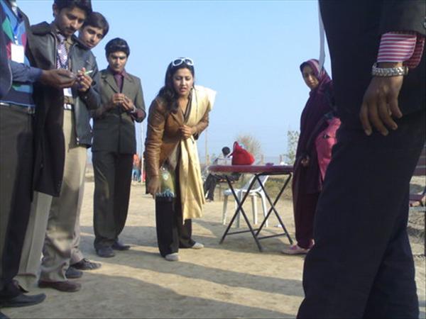 A MARBLES COMPETITION IN CS DEPT. TEACHER AIMING AT MARBLE