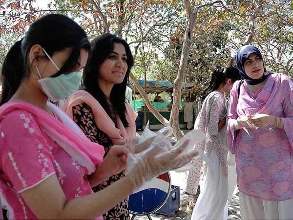 Students of Bahria University during the campaign to keep the city clean after inaugural ceremony of Community Support Programme organized by Bahria University